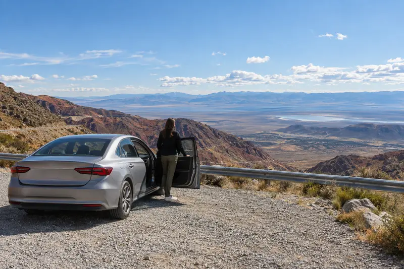 Our vehicle and driver at a viewpoint on the southern side of the pass