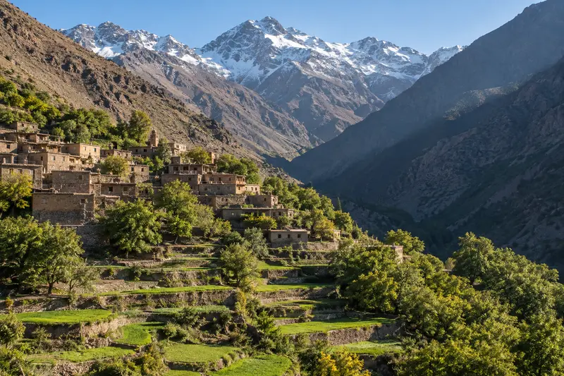 The village of Imlil below the High Atlas ridges with terraced fields on the slopes