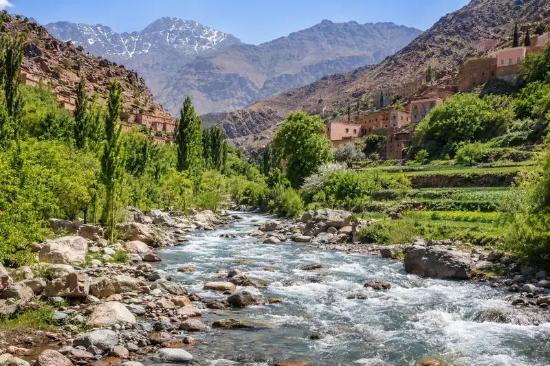 The Ourika river running below terraced Berber villages in the High Atlas